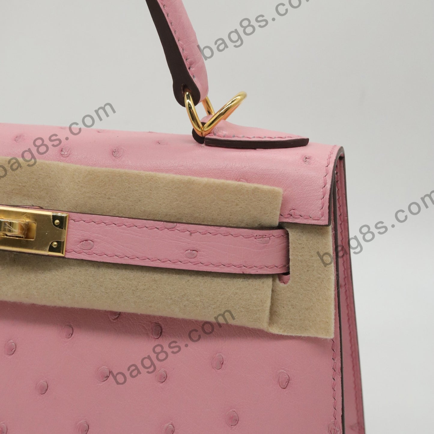 Ostrich leather Kelly 22 cherry pink gold buckle